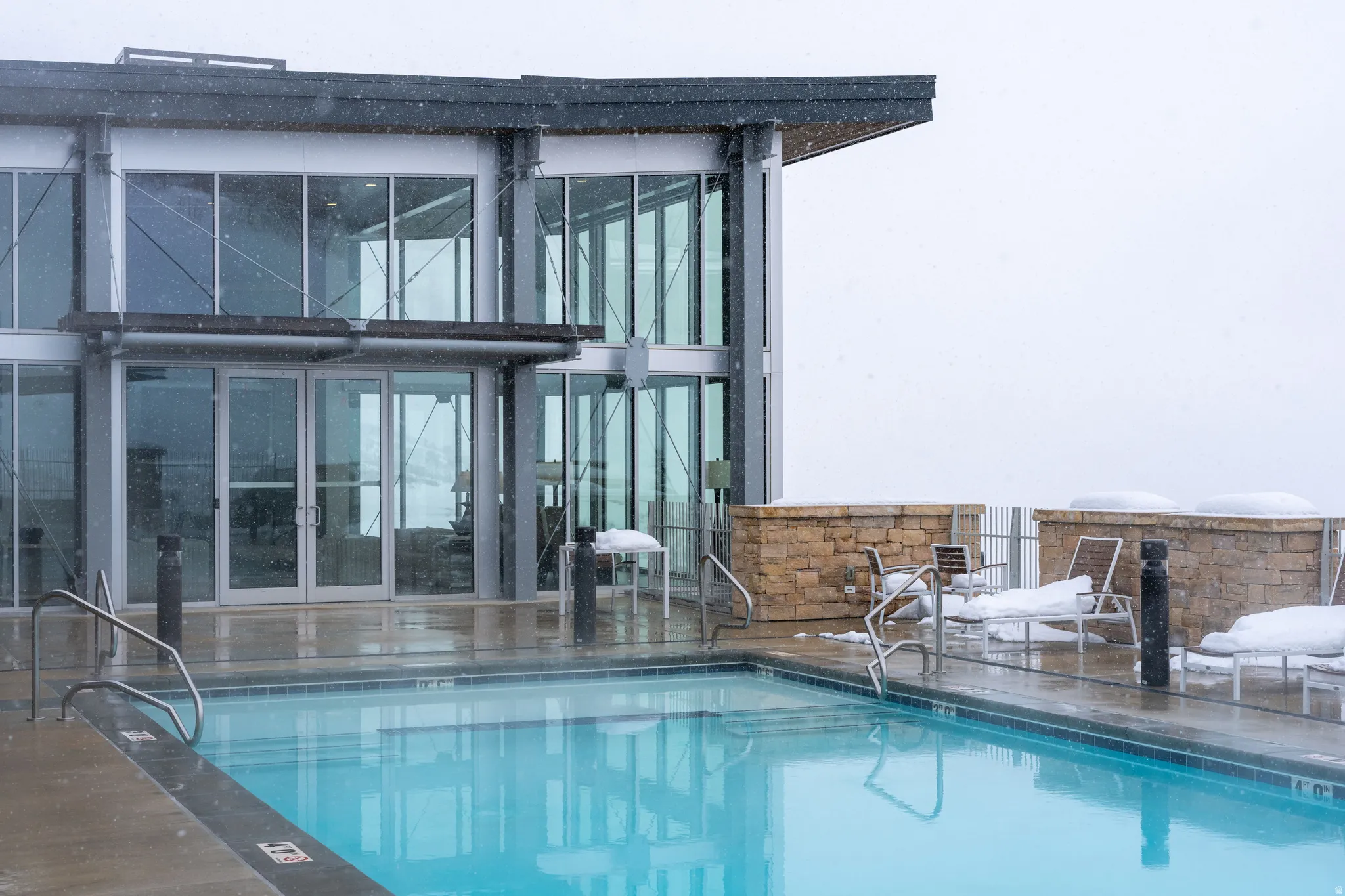 Community pool featuring a patio