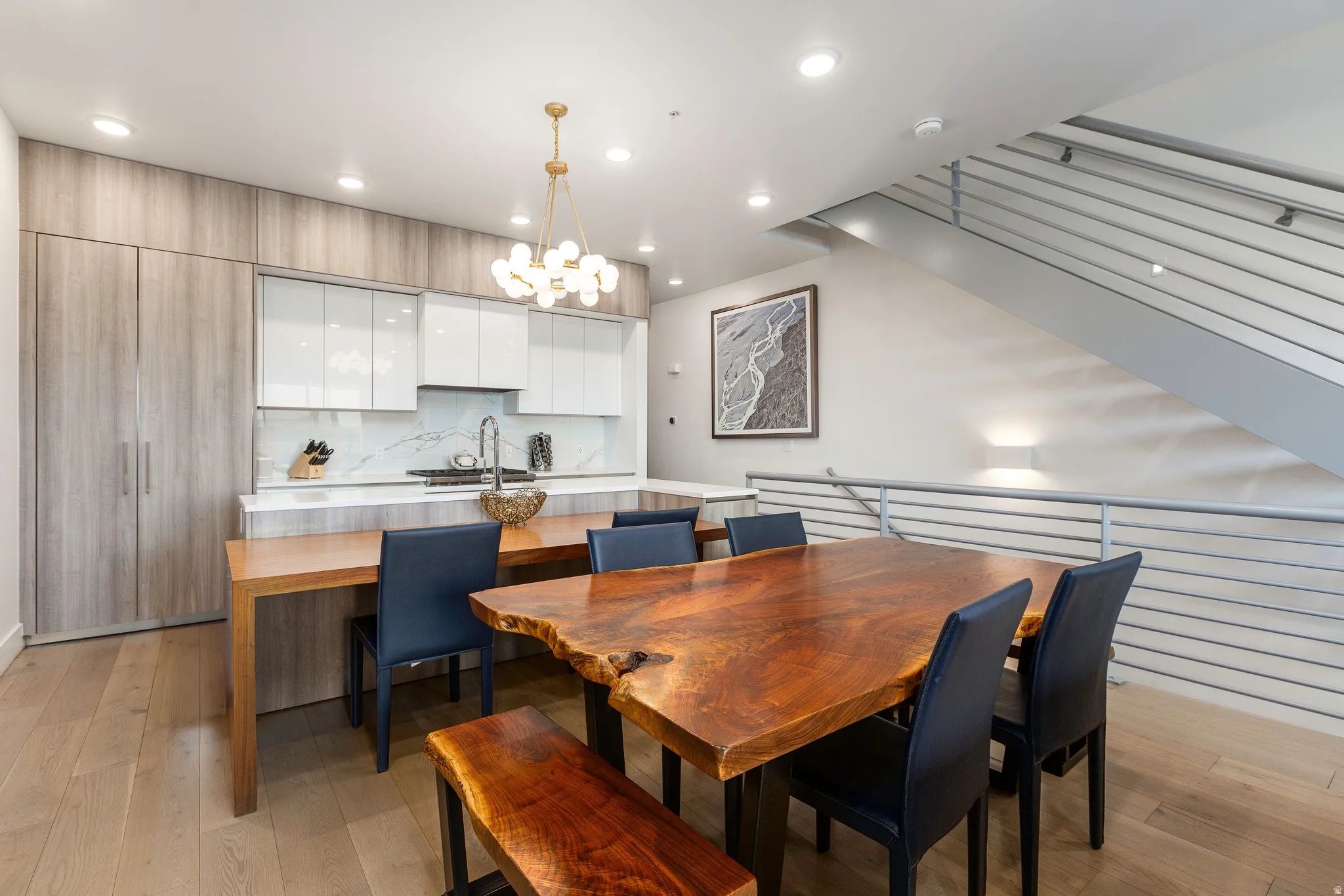 Dining space featuring light wood-style flooring and hanging lights