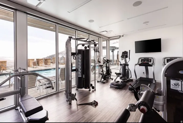 Exercise room with floor to ceiling windows