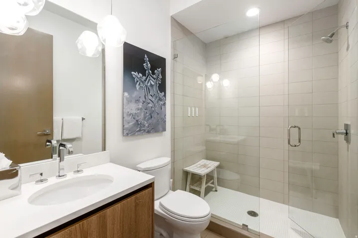 Full bathroom featuring vanity and a shower stall