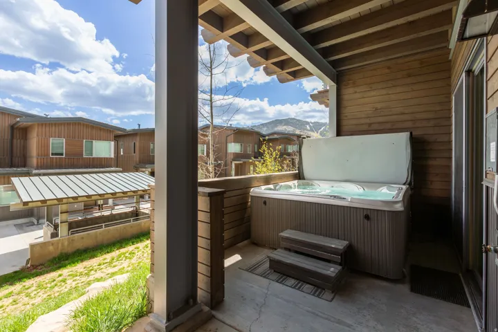 View of patio / terrace with a hot tub