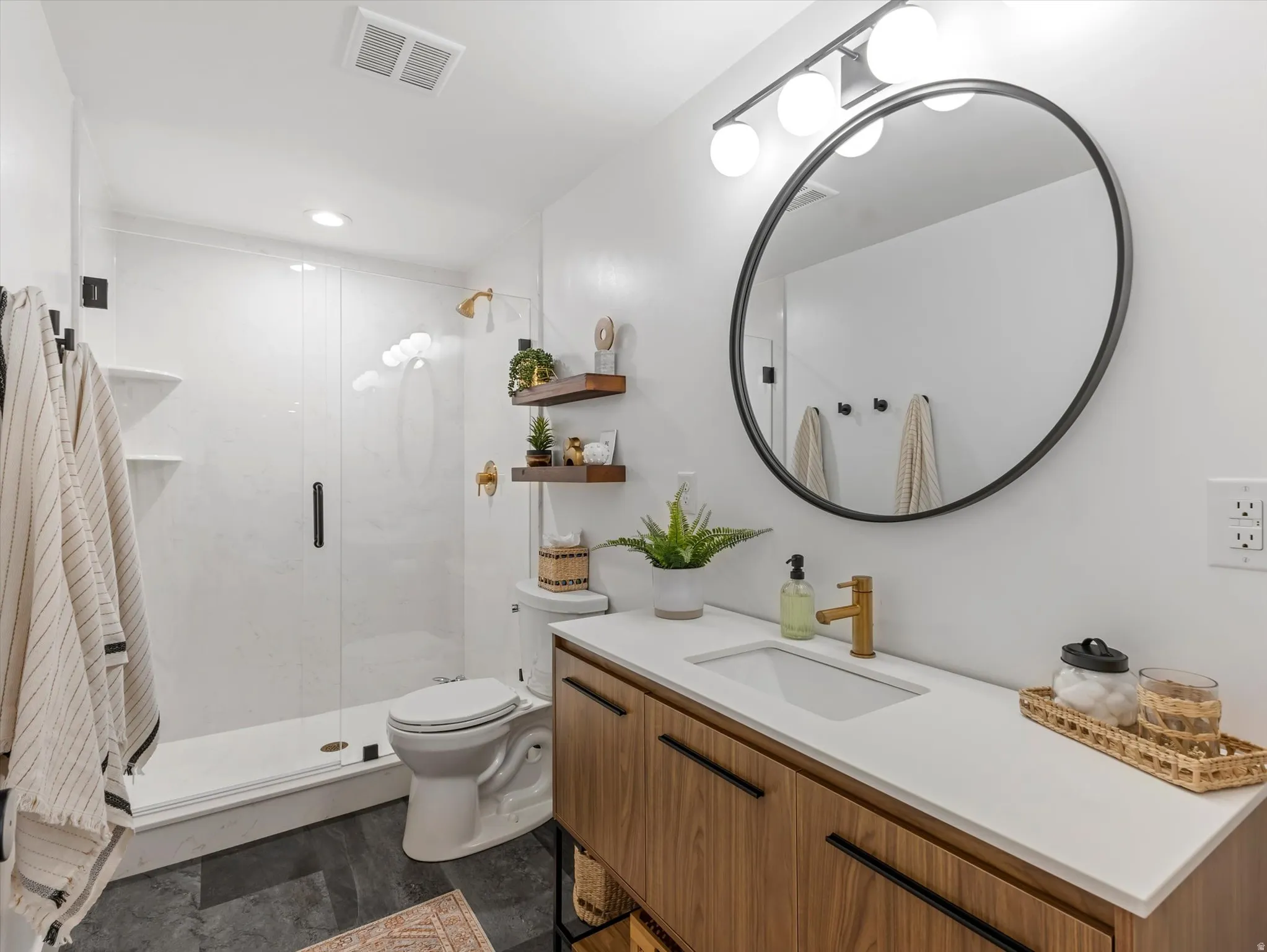 Full bath with vanity, a marble finish shower, and recessed lighting