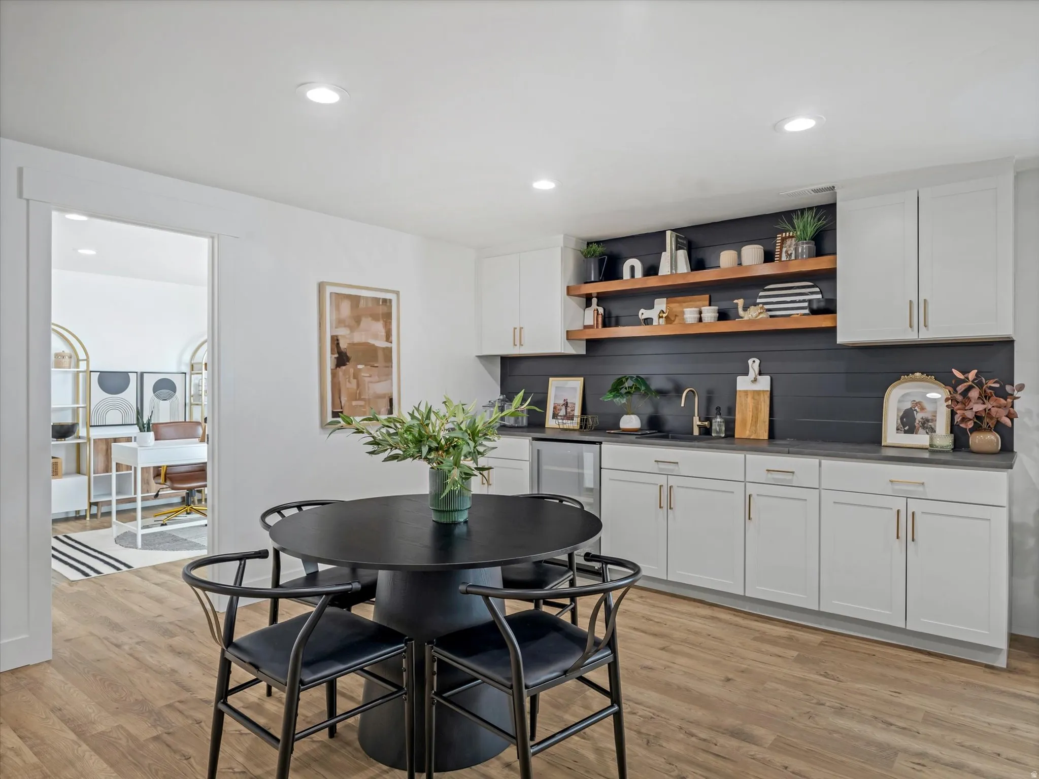 Dining room with recessed lighting and light wood finished floors