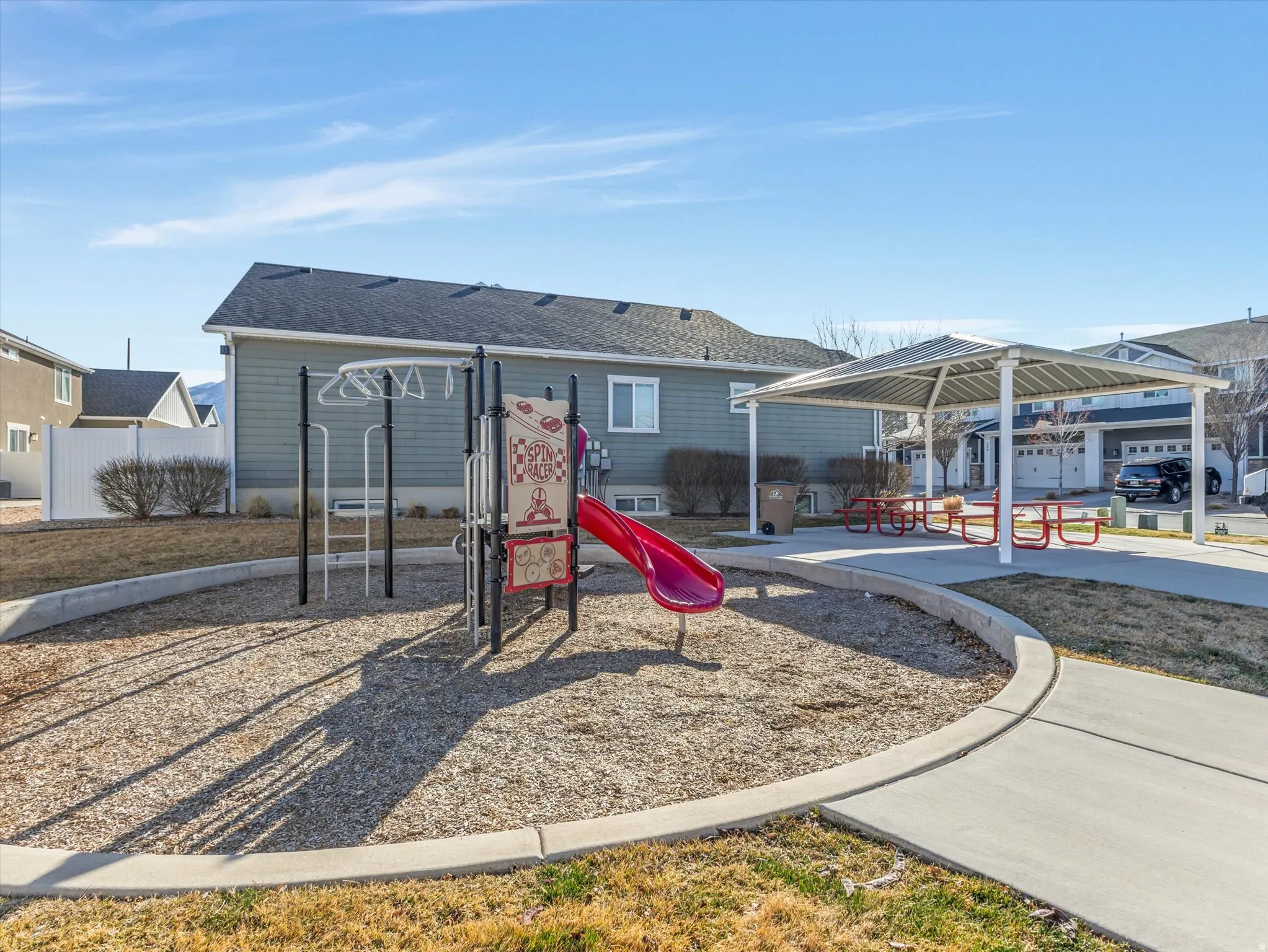 Community play area featuring a patio and a gazebo