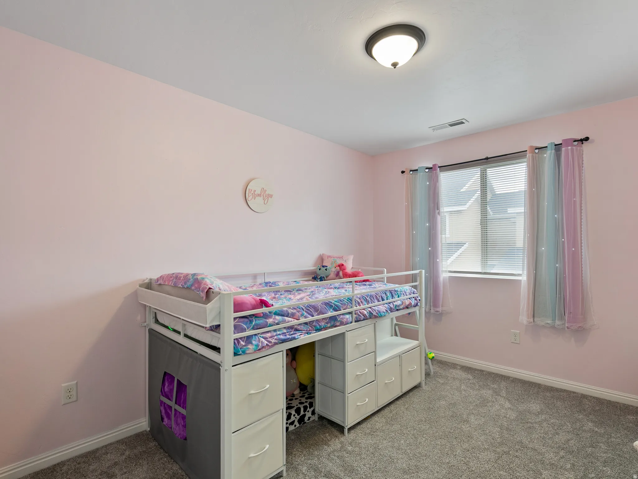 Bedroom with carpet flooring and baseboards