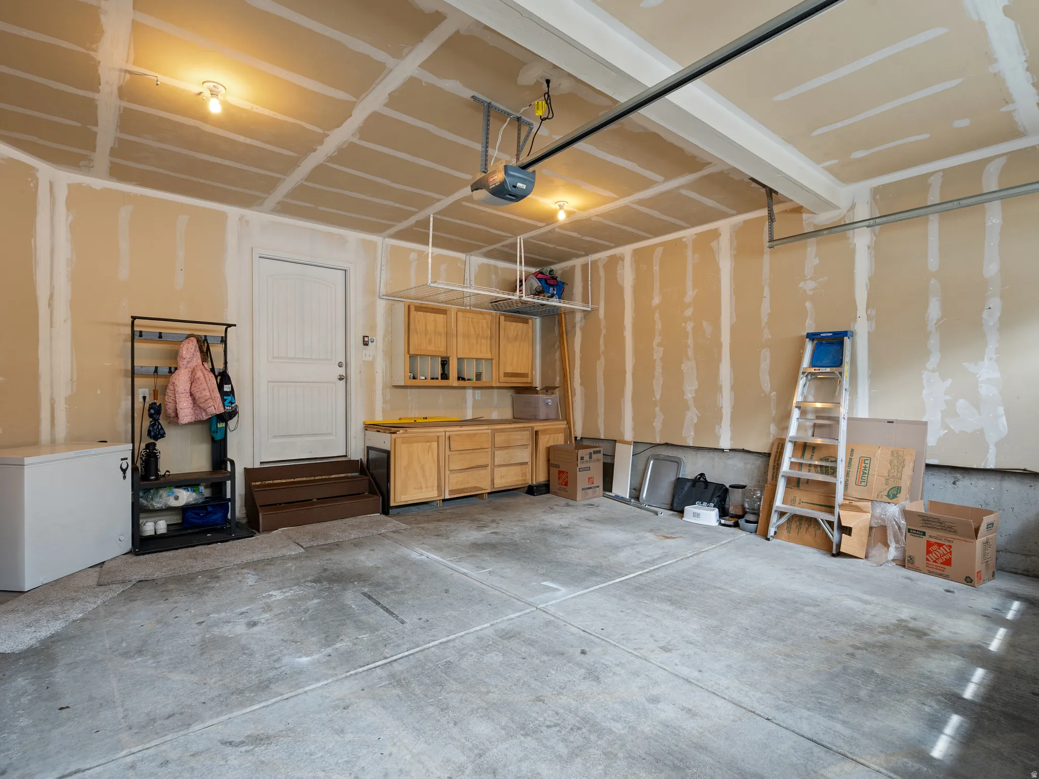 Garage featuring a garage door opener