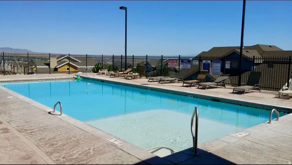Community pool featuring a patio area