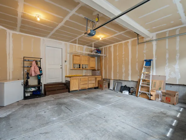 Garage featuring a garage door opener