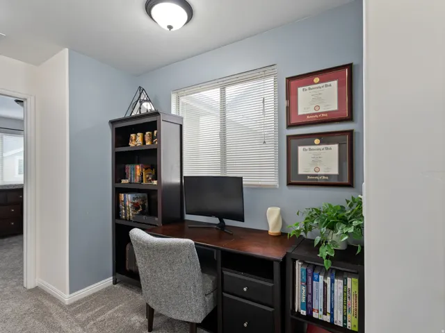Office space with carpet floors and baseboards