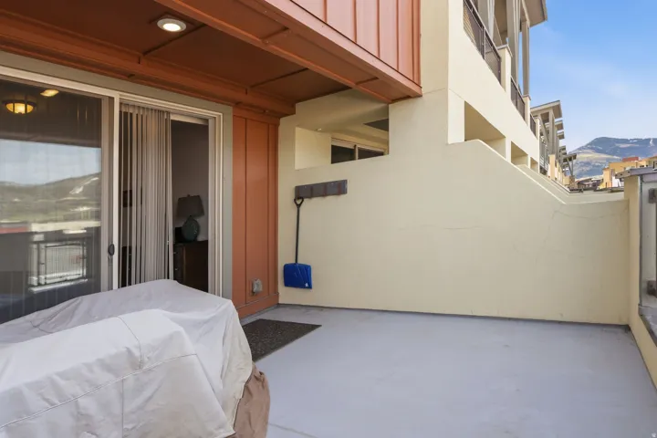 Bedroom featuring a mountain view and concrete flooring