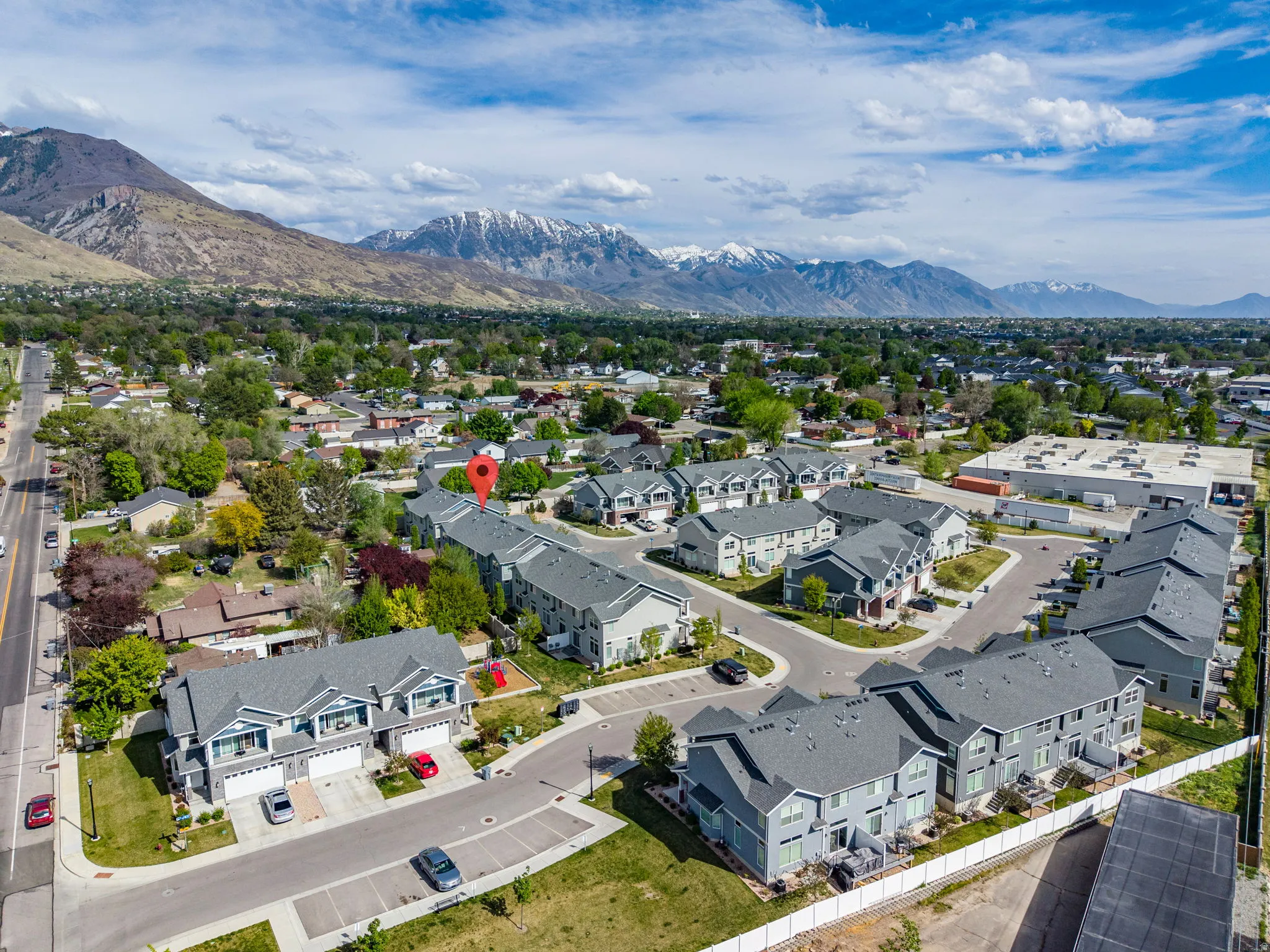 Aerial view of residential area with a mountainous background