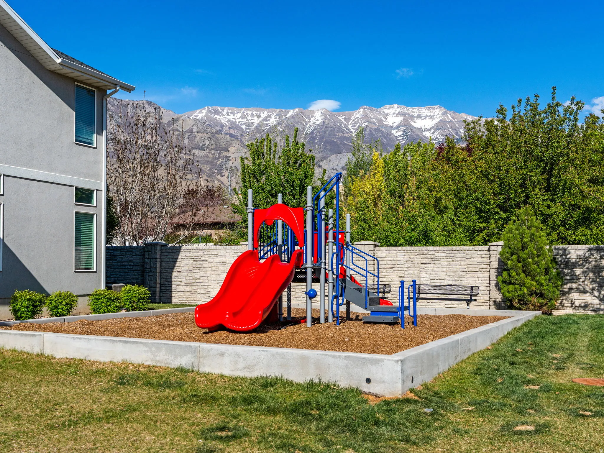 Communal playground featuring a mountain view