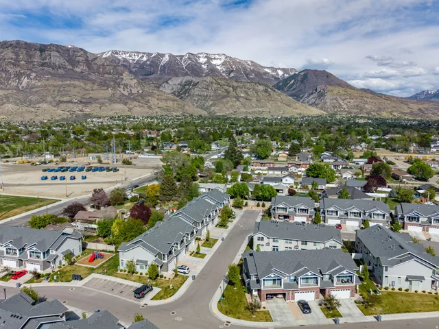 Aerial perspective of suburban area with a mountainous background