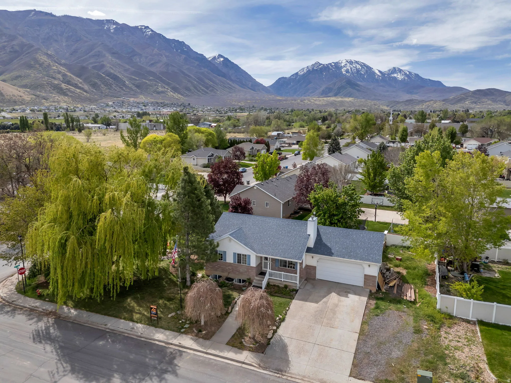 Aerial perspective of suburban area with a mountain backdrop