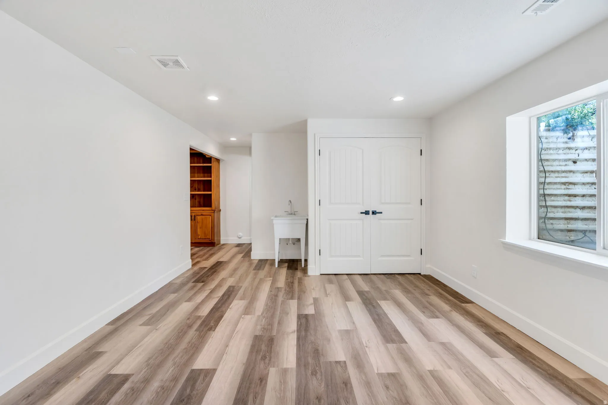 Basement Living room wired and plumbed to make it your own entertainment space