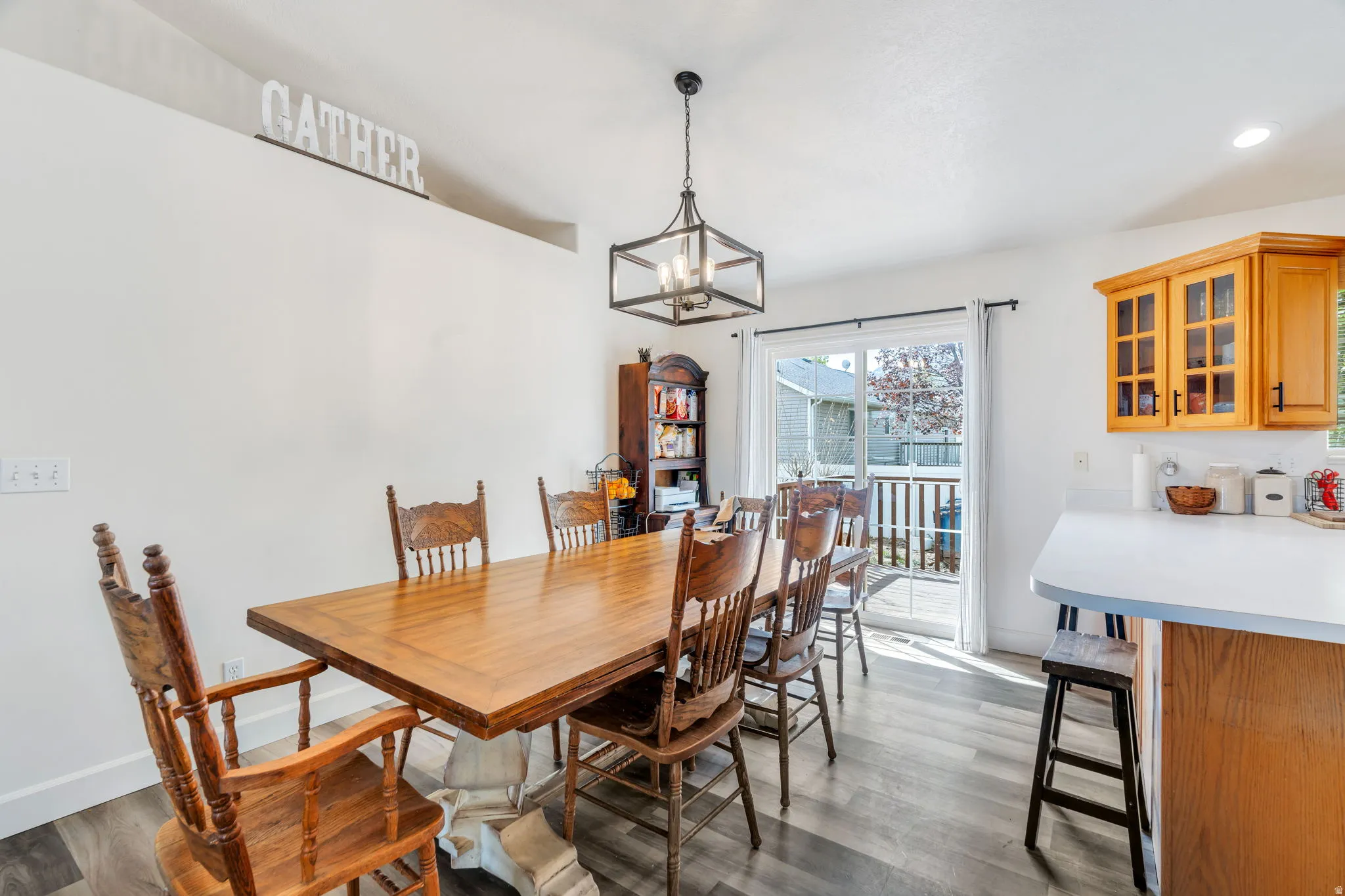 Dining room featuring wood finished floors and new lights