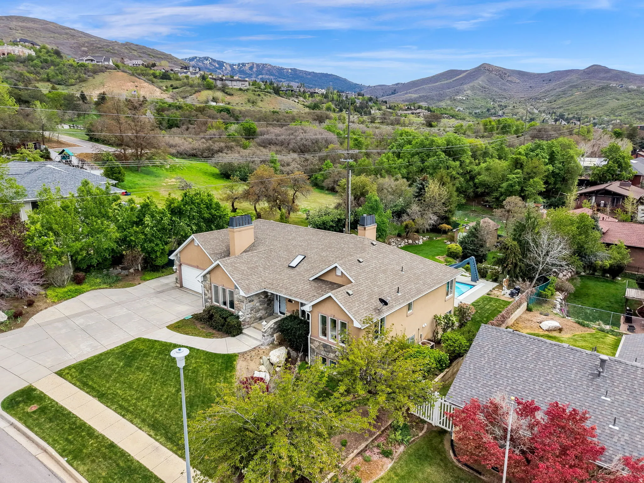 View from above of property with a mountain backdrop