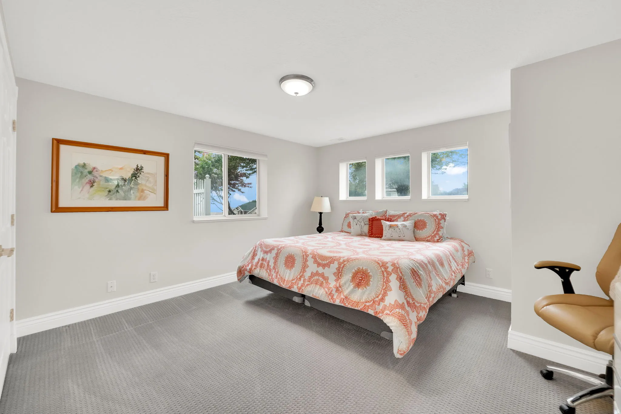 Carpeted bedroom featuring baseboards