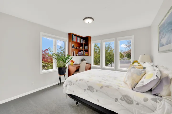 Carpeted bedroom with baseboards