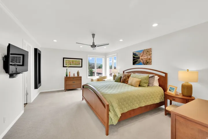 Master Bedroom with crown molding, recessed lighting, light colored carpet, and ceiling fan