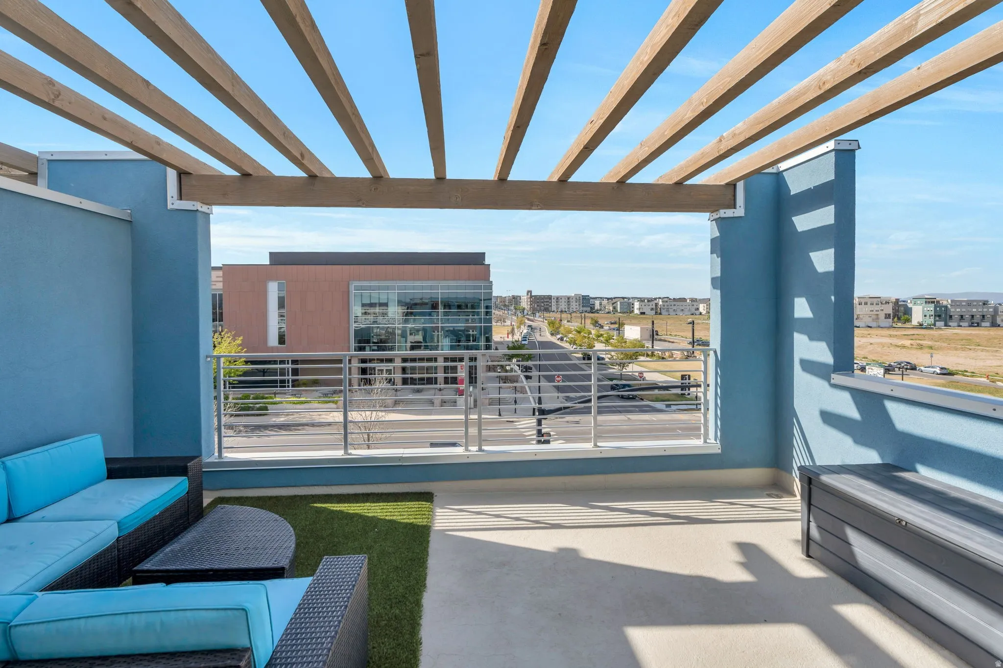 View of patio with an outdoor hangout area and a city view