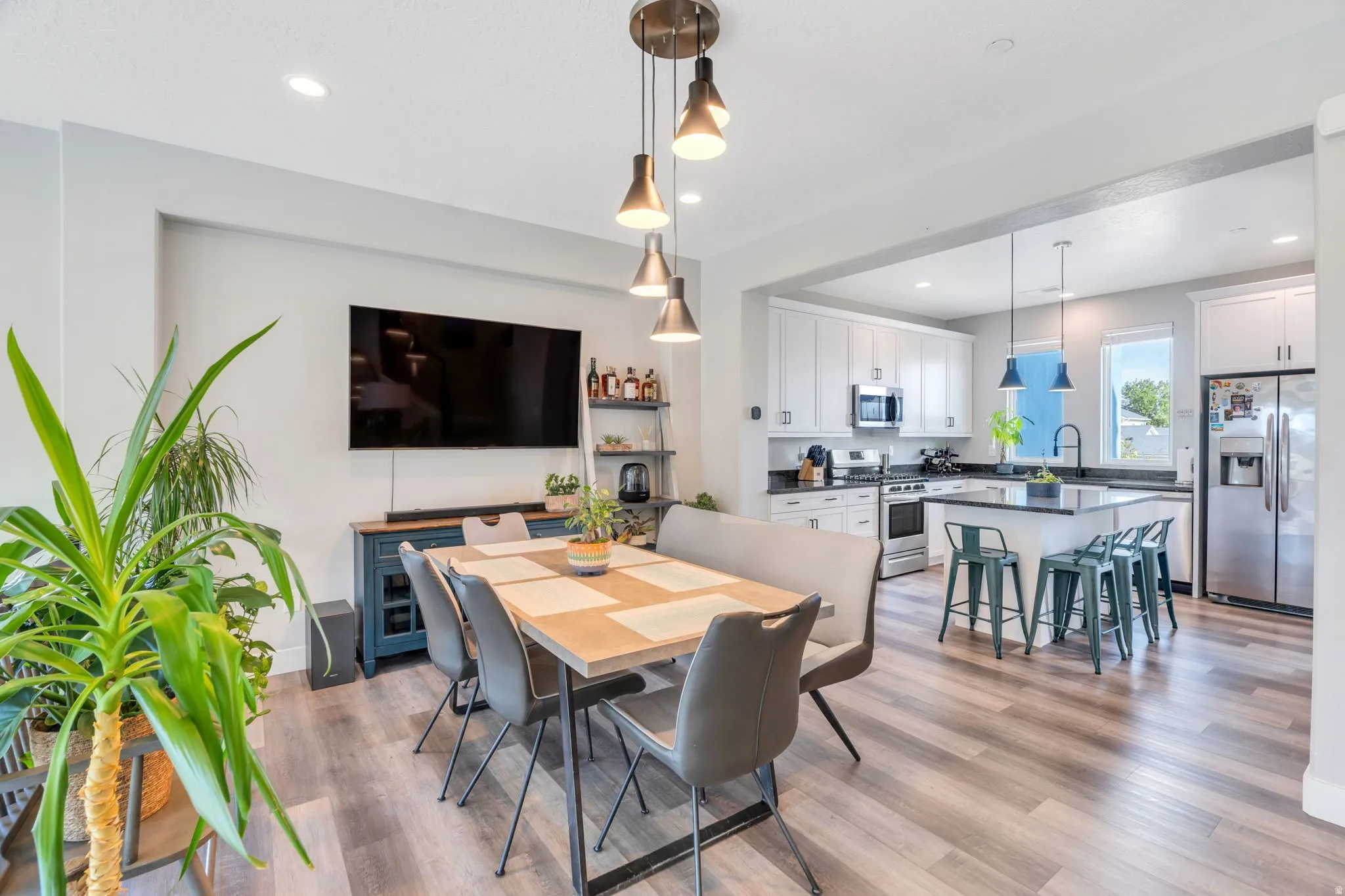 Dining area featuring light wood-style flooring and recessed lighting