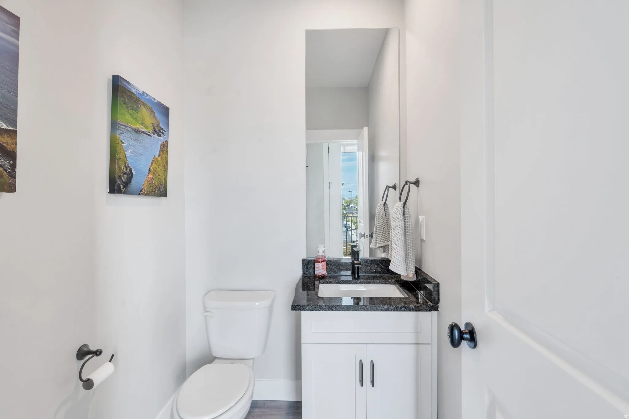 Half bath with toilet and vanity