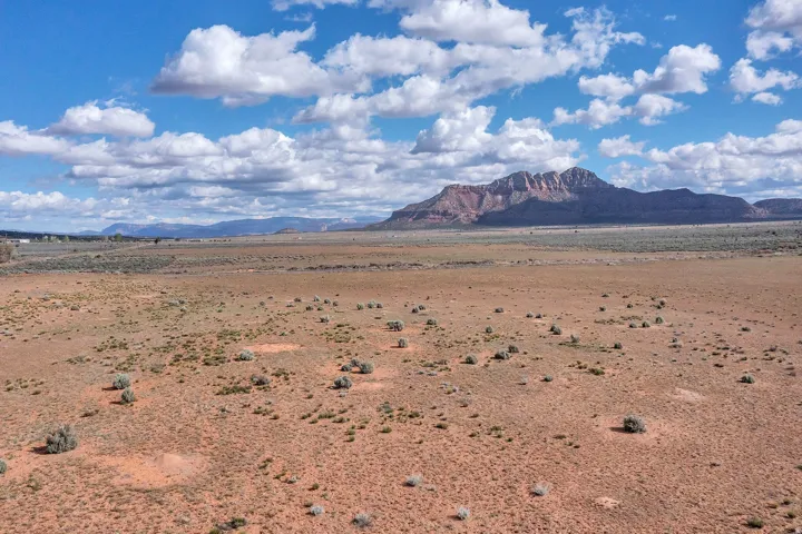View of mountain backdrop with a desert landscape and rural landscape