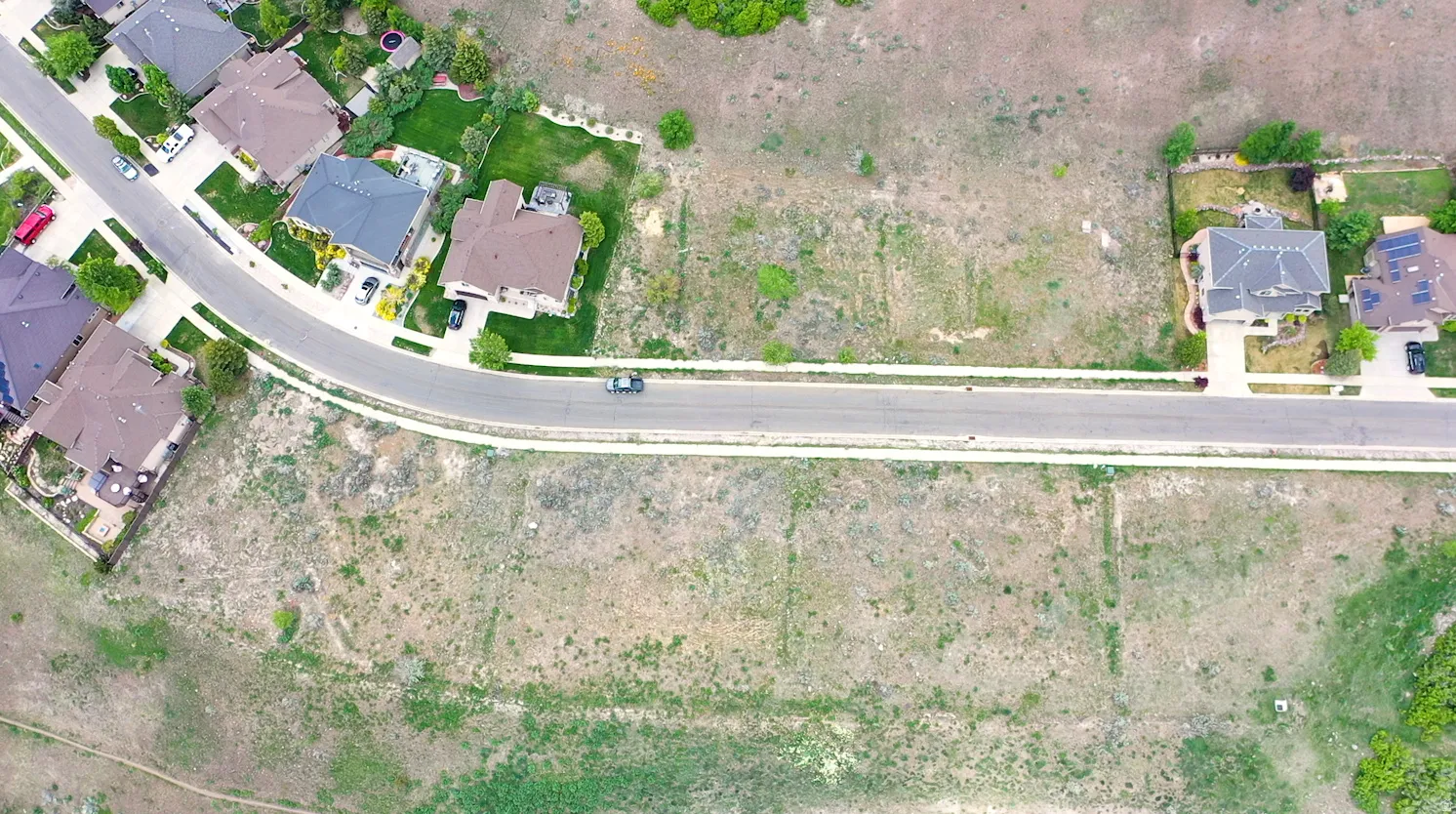Aerial overview of property's location with nearby suburban area