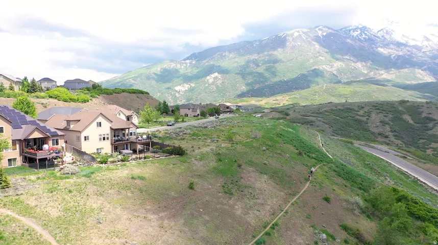 View of mountain backdrop featuring nearby suburban area