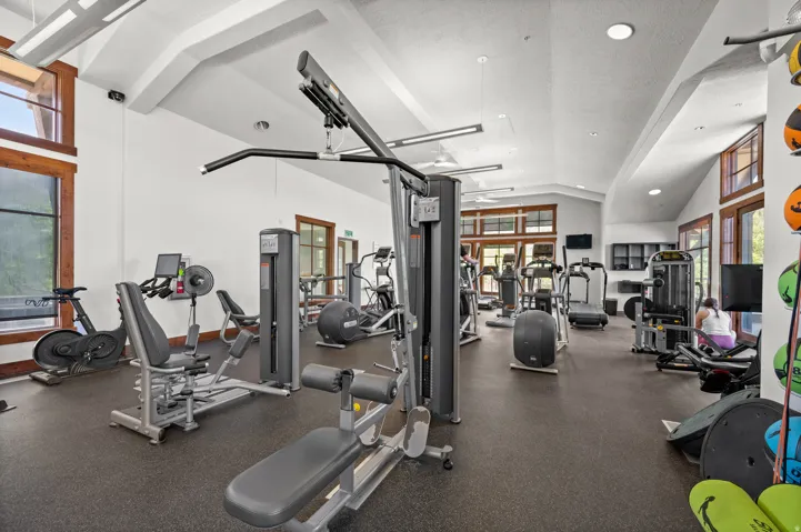 Gym featuring recessed lighting and vaulted ceiling