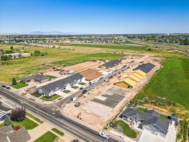 Aerial view of property's location featuring nearby suburban area and a nearby body of water
