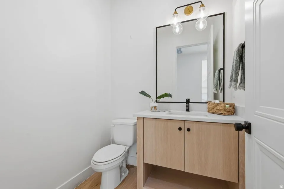 Bathroom with vanity and light wood finished floors