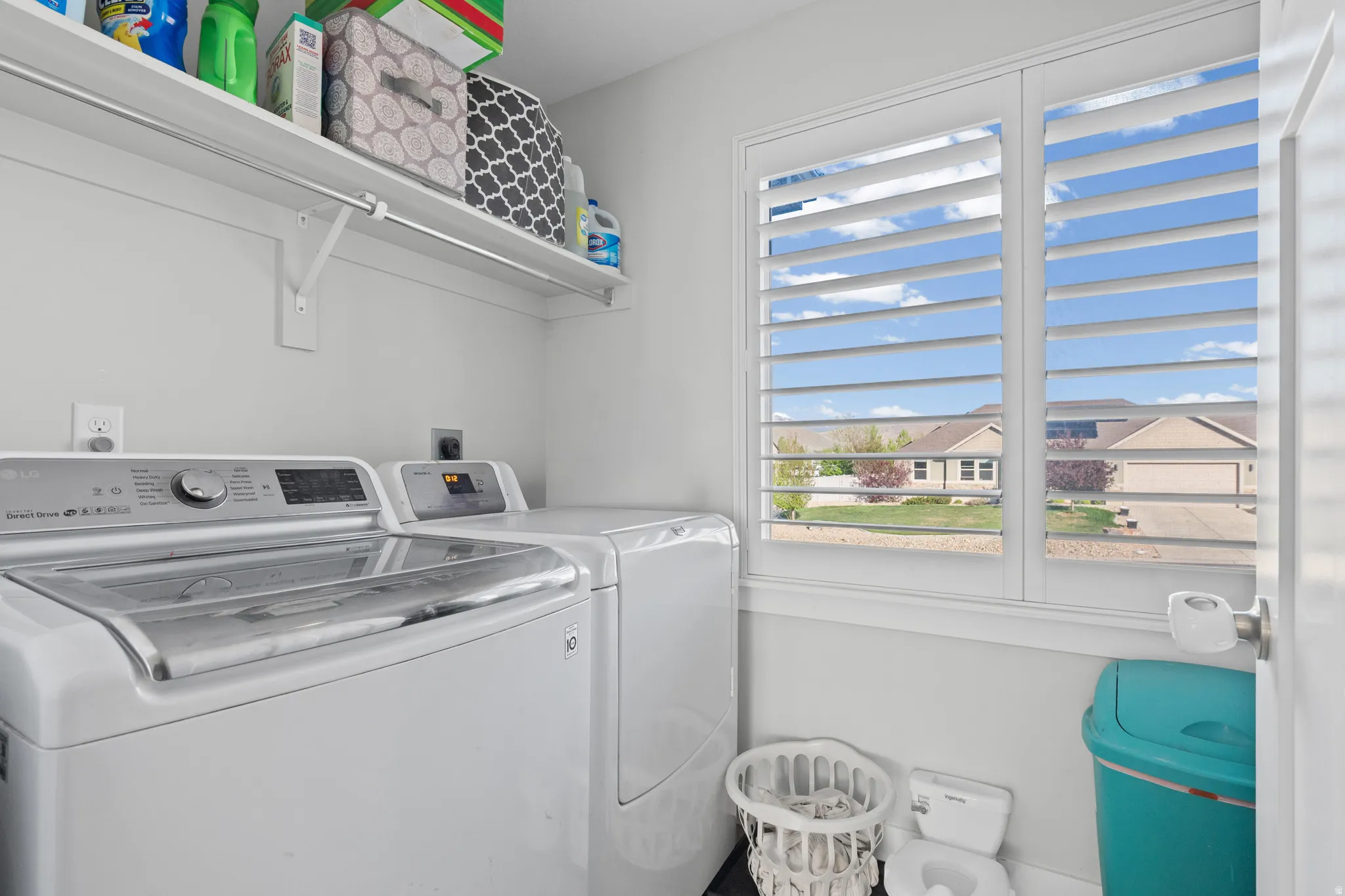 Laundry area featuring washer and clothes dryer