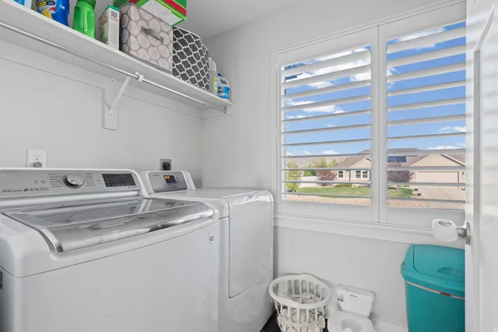 Laundry area featuring washer and clothes dryer