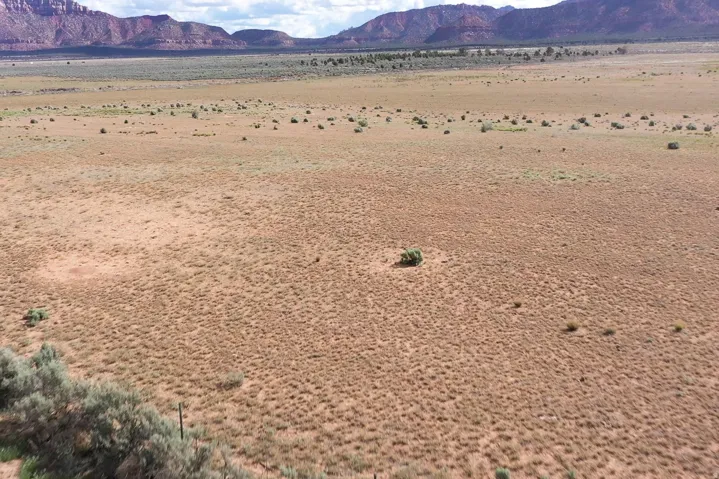 View of mountain background featuring a desert landscape and rural landscape