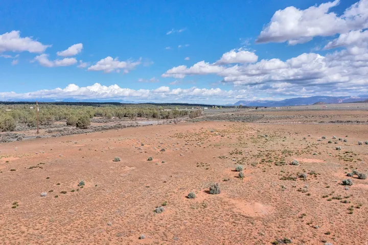 View of mountain backdrop with a desert landscape and rural landscape
