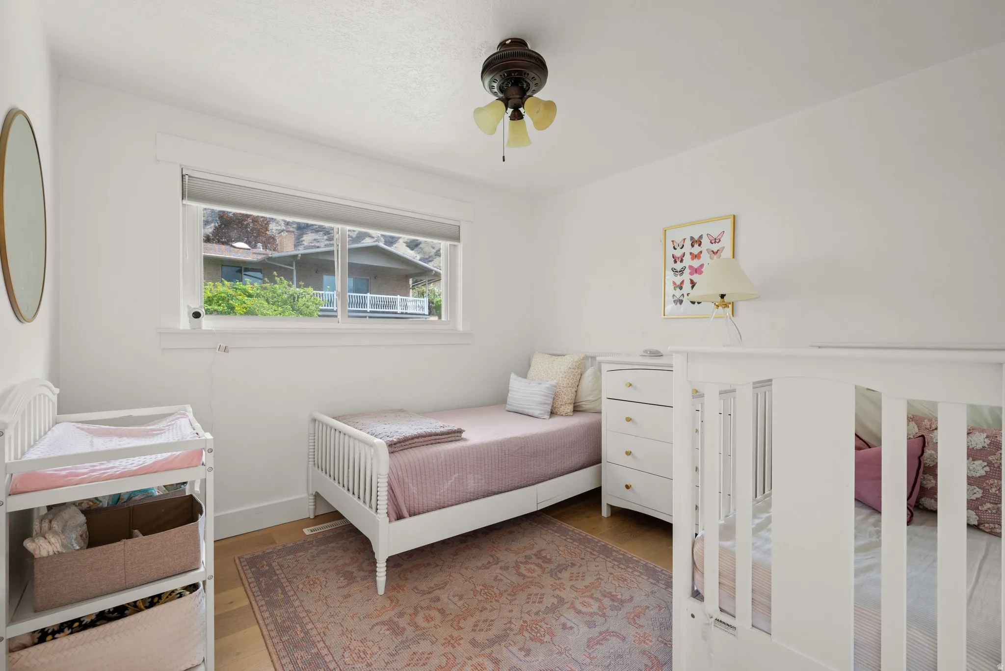 Bedroom featuring light wood-style floors and ceiling fan