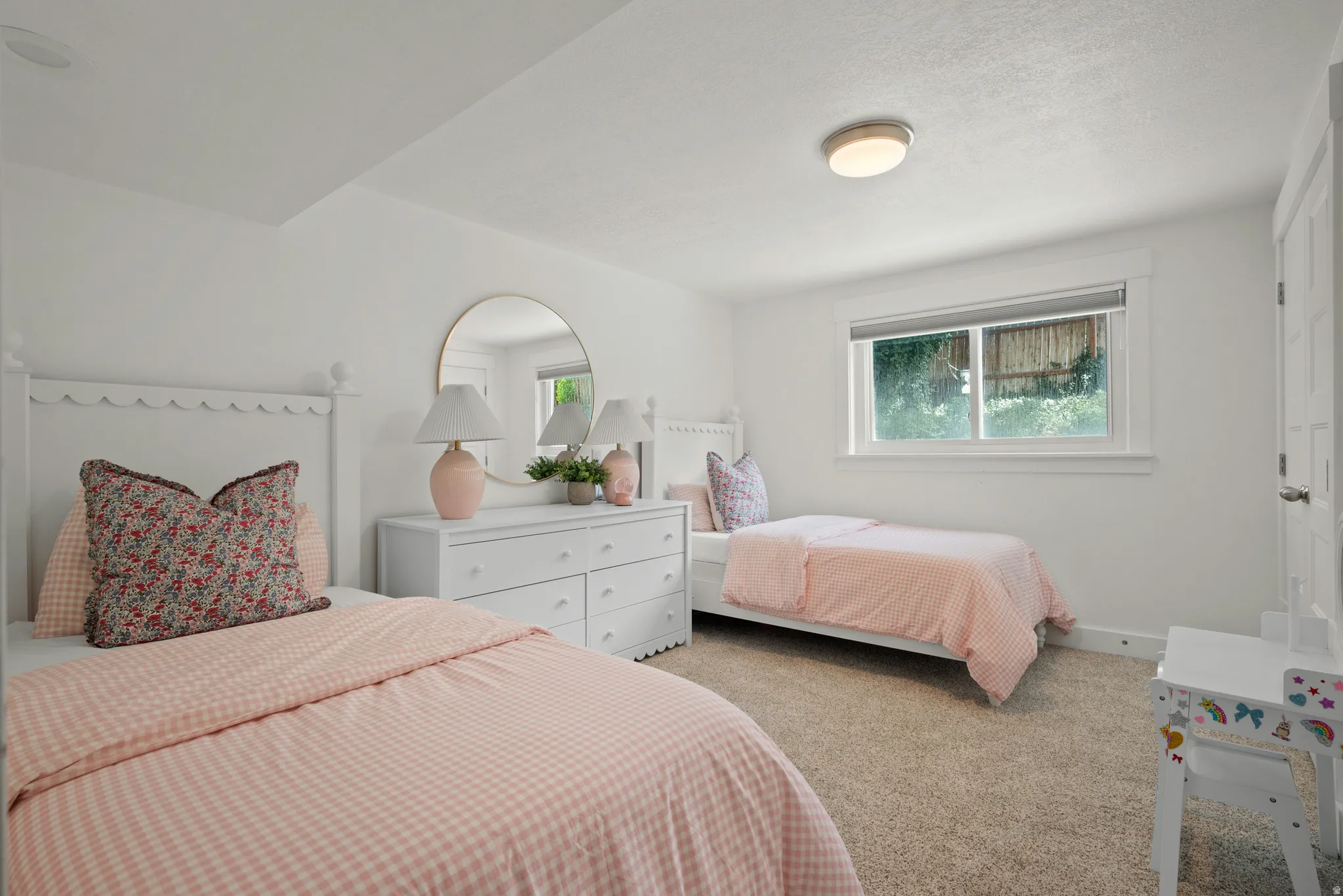 Carpeted bedroom with multiple windows