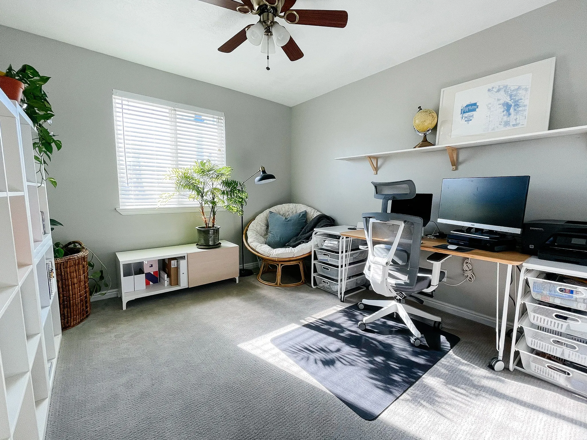 Home office featuring ceiling fan and light colored carpet