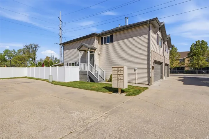 View of home's exterior featuring an attached garage and driveway