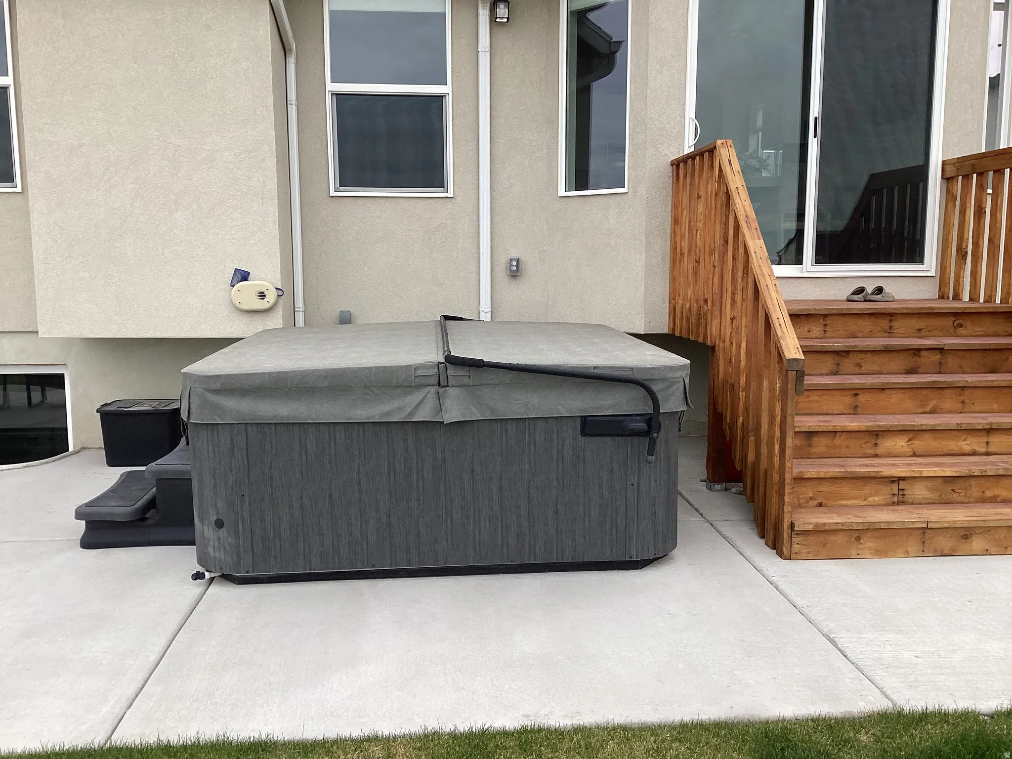 View of patio featuring a hot tub