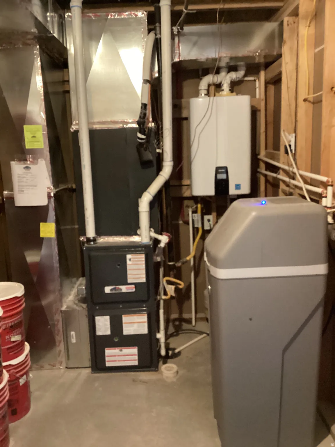 Utilities featuring water heater and heating unit
