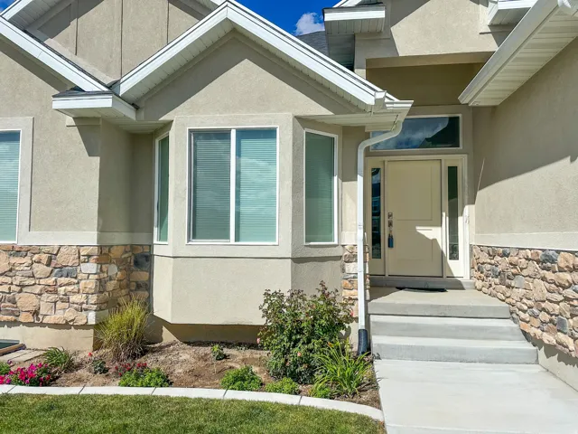 Stucco exterior with stone veneer accents