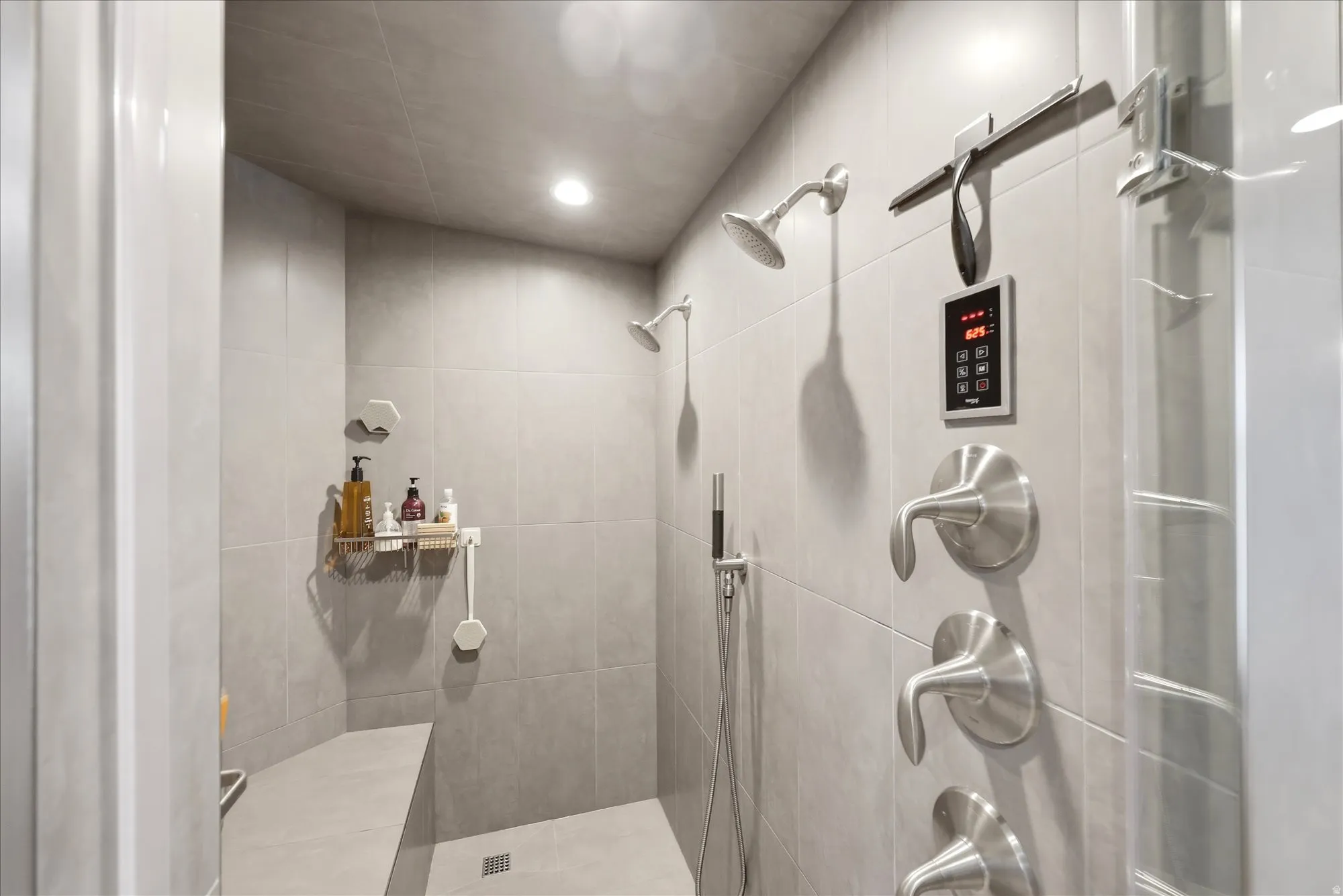 Bathroom featuring a tile shower and recessed lighting