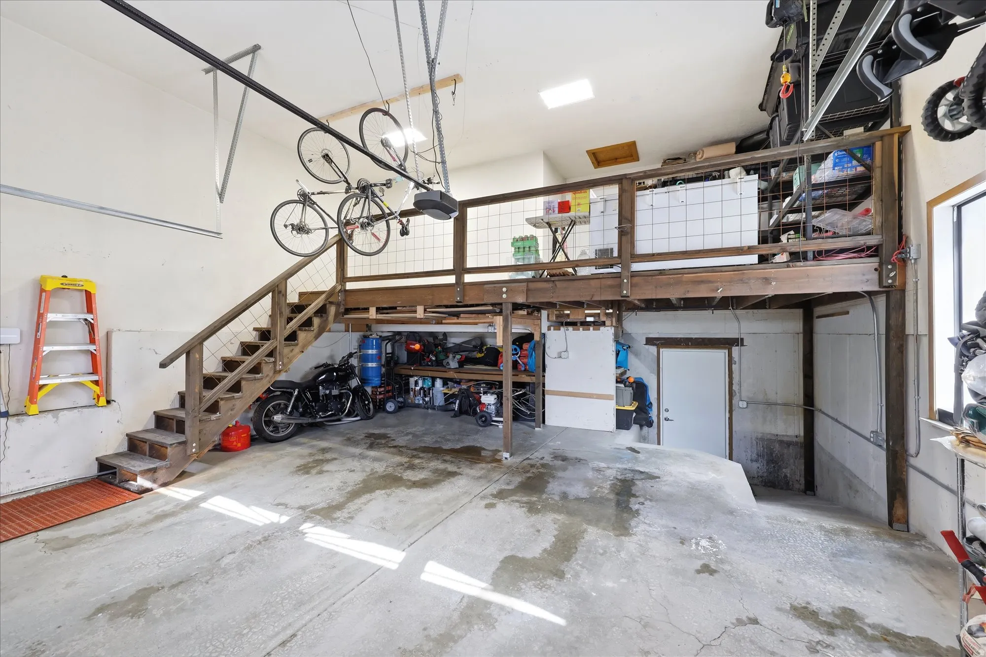 Garage featuring a garage door opener
