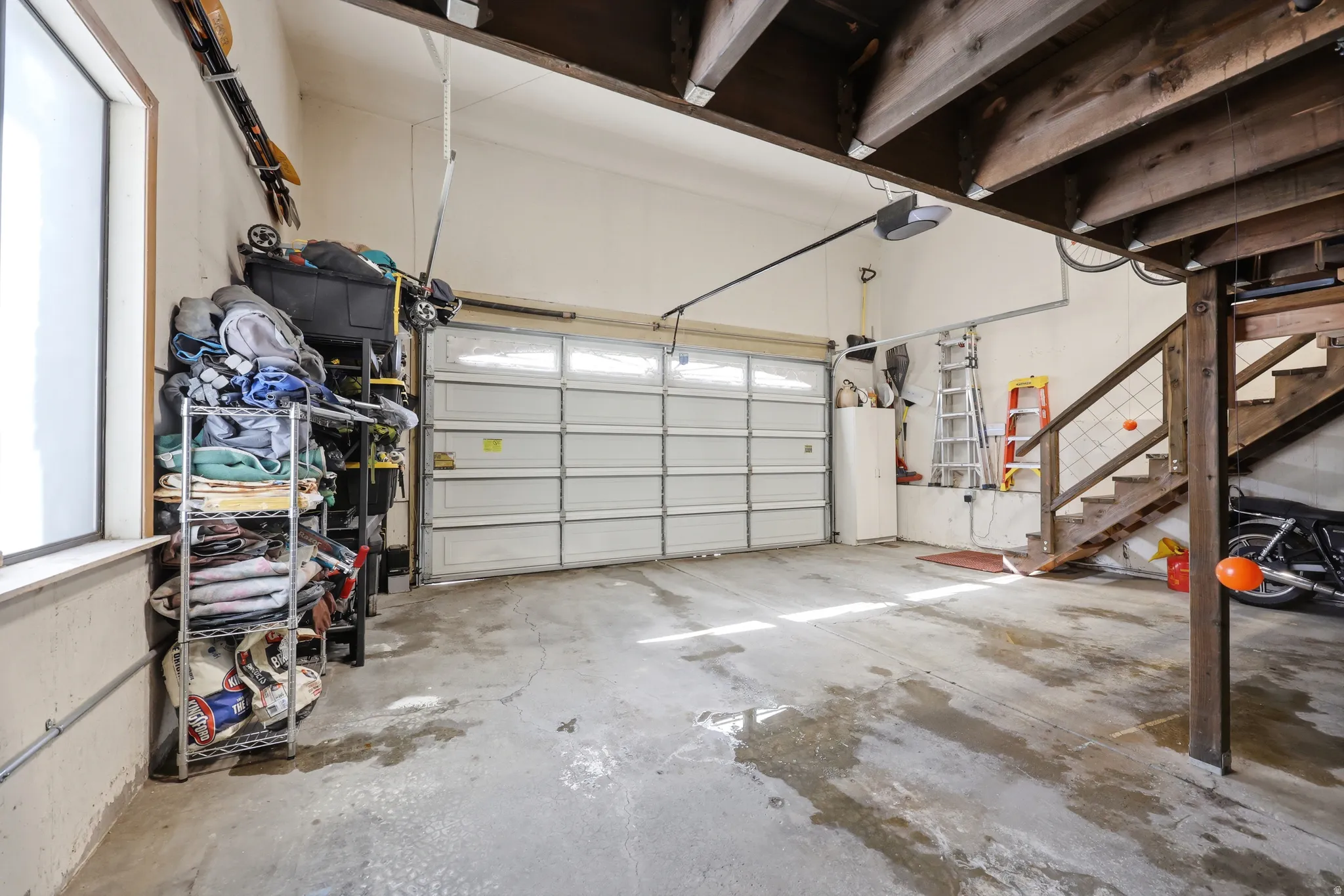 Garage featuring a garage door opener