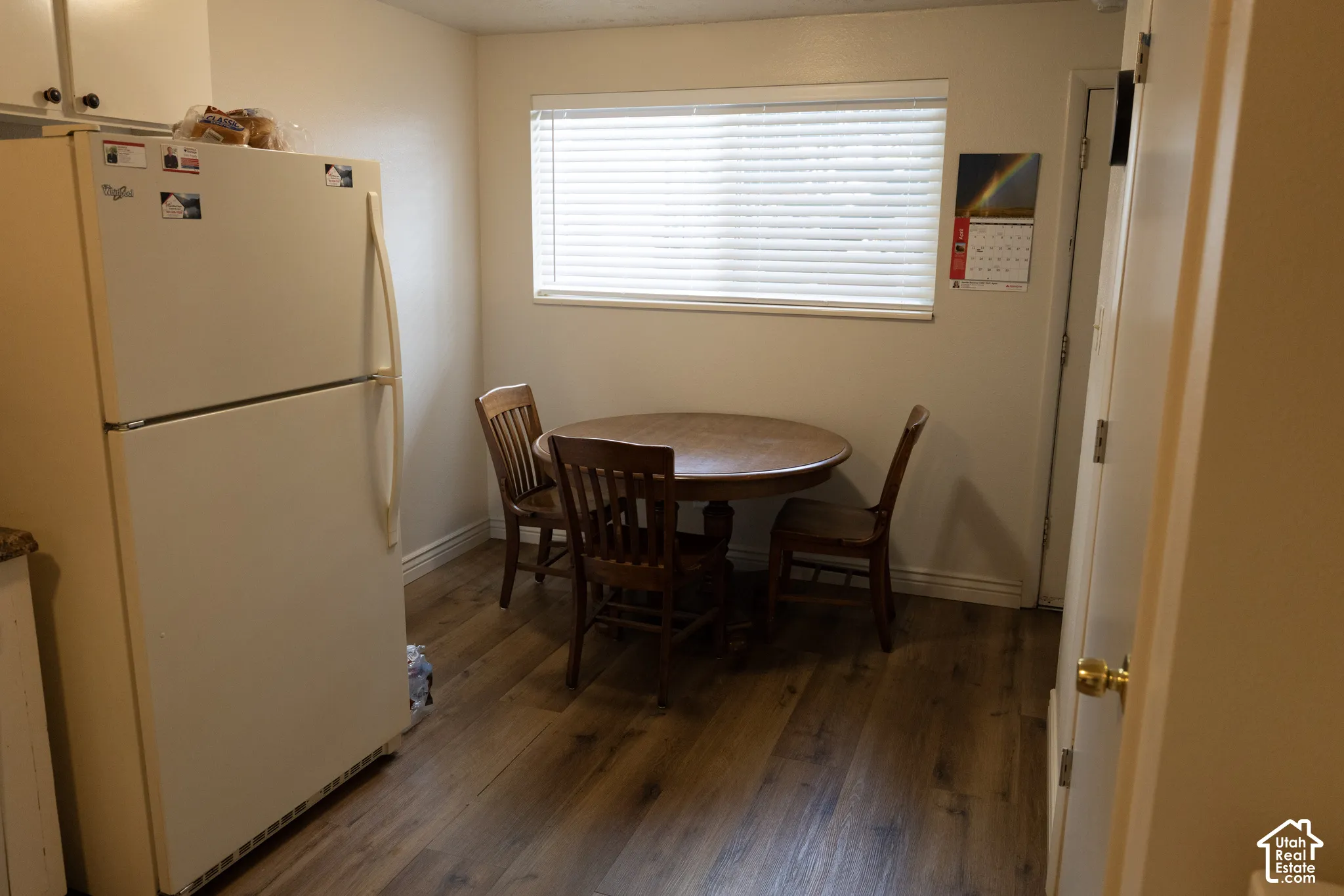 Dining area featuring dark wood-type flooring