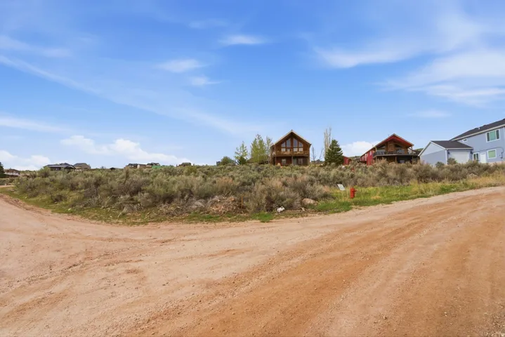 View of yard with a rural view
