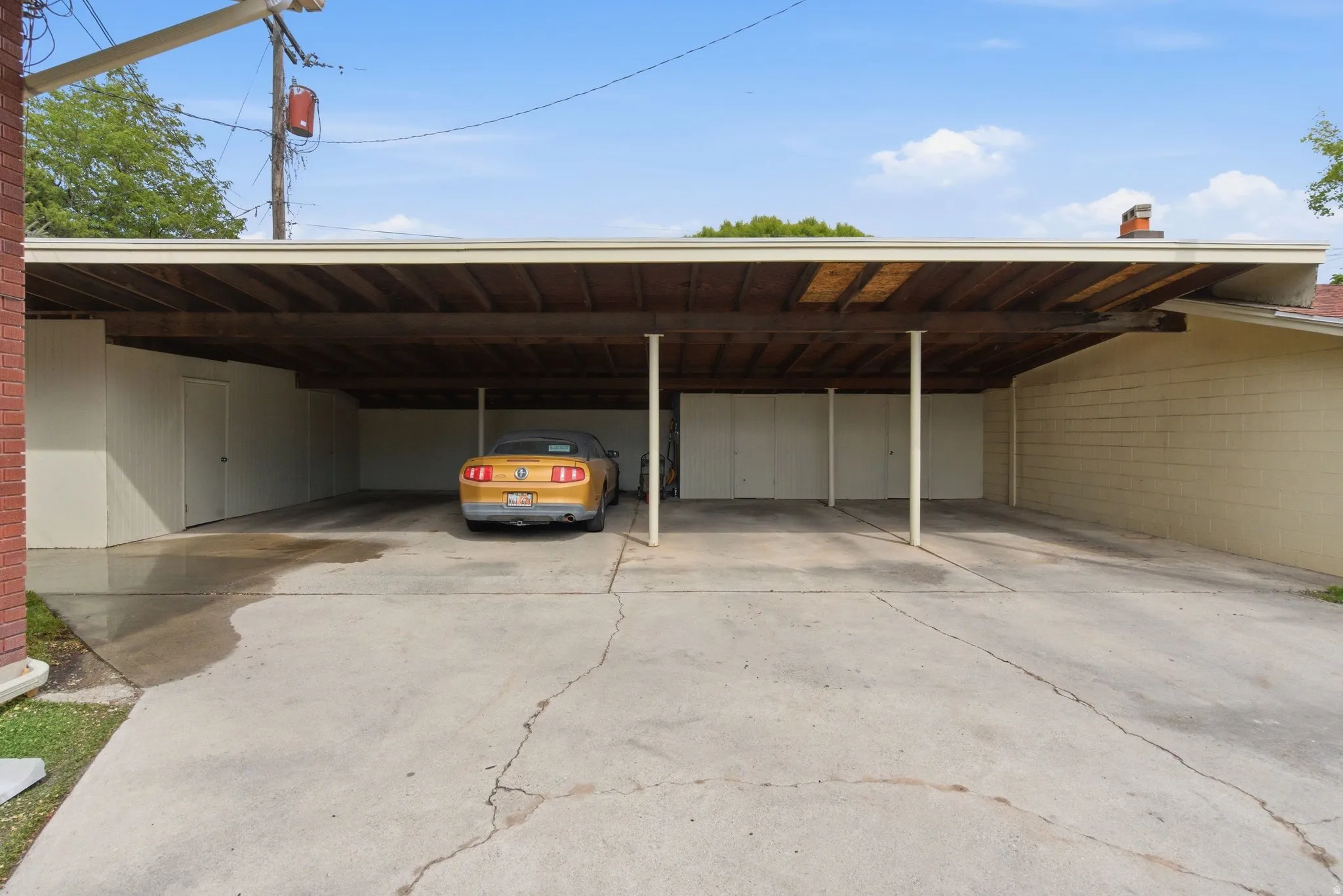 View of parking with a carport